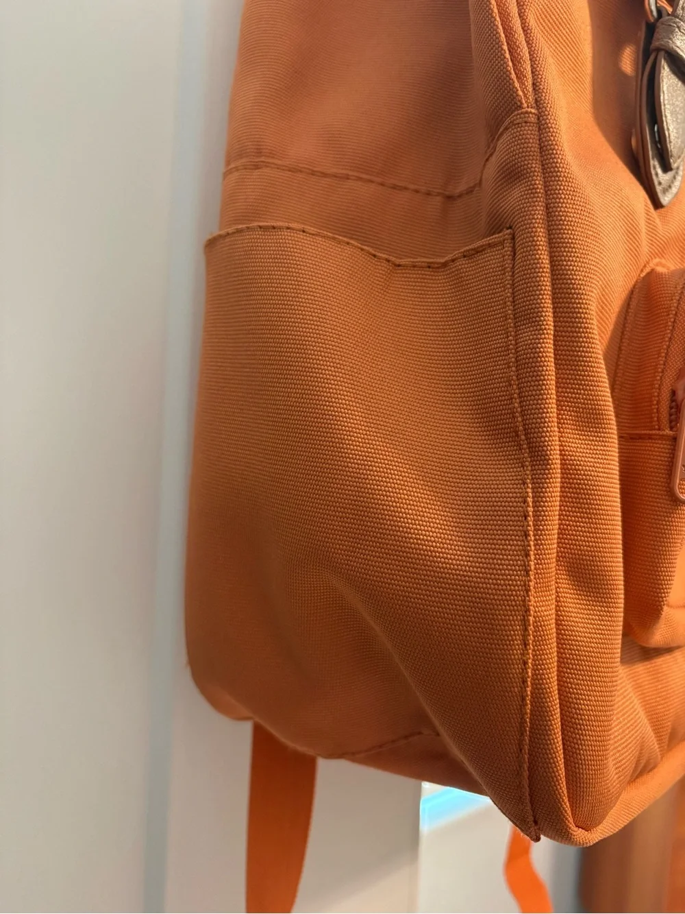 Orange Canvas Backpack with Brown Accents